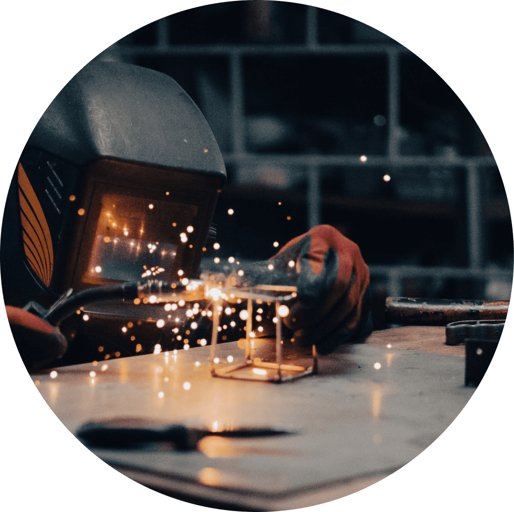 Image of a person soldering a wire cube