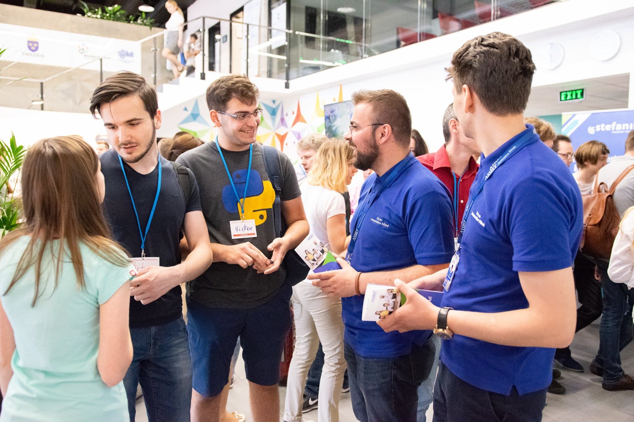 ASSIST Software representants talking with the person interested in discovering new opportunities at Codecamp Chișinău 2018